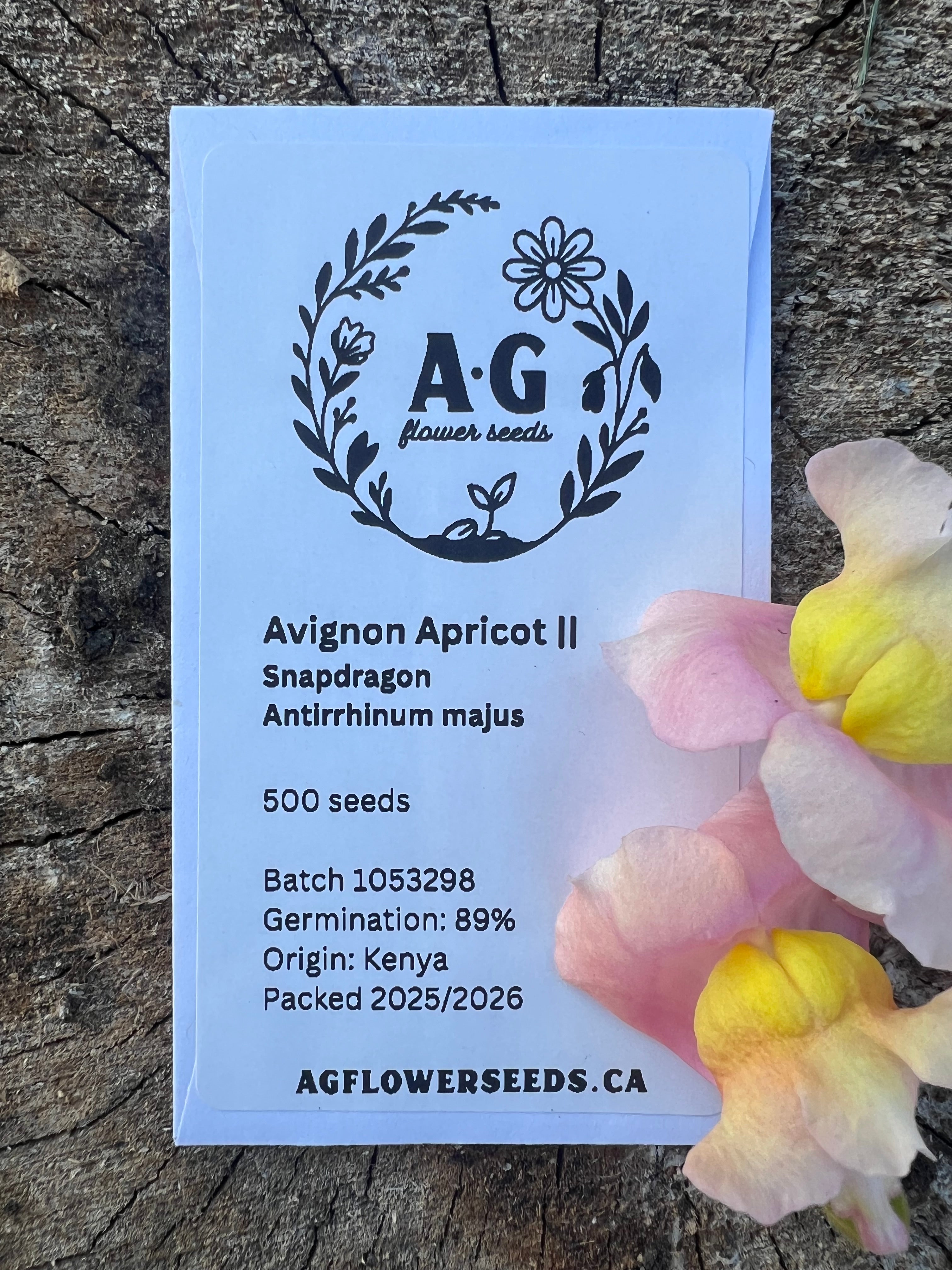 AG Flower Seeds | Seeds packet with branding on a wooden surface with flowers